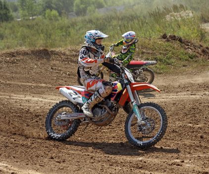 ARSENYEV, RUSSIA - AUG 30: Rider participates in the round of the 2014 Russia motocross championship on August 30, 2014 in Arsenyev, Russia.