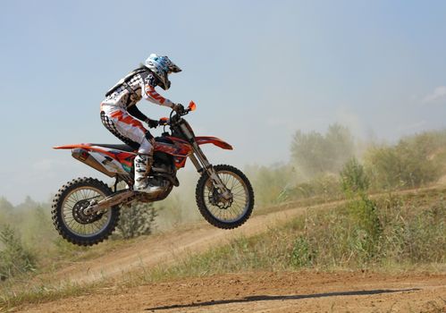 ARSENYEV, RUSSIA - AUG 30: Rider participates in the round of the 2014 Russia motocross championship on August 30, 2014 in Arsenyev, Russia.