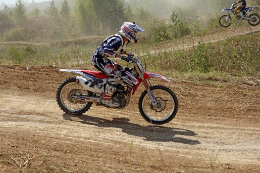 ARSENYEV, RUSSIA - AUG 30: Rider participates in the round of the 2014 Russia motocross championship on August 30, 2014 in Arsenyev, Russia.