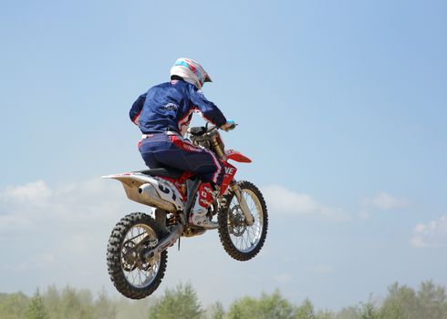 ARSENYEV, RUSSIA - AUG 30: Rider participates in the round of the 2014 Russia motocross championship on August 30, 2014 in Arsenyev, Russia.