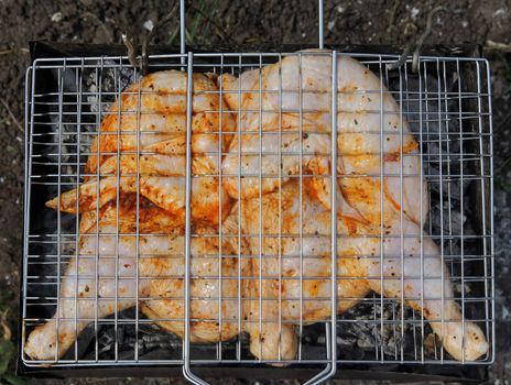 Roast chicken on grill