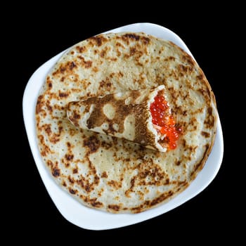 Pancakes with red caviar on black background, isolated,top view