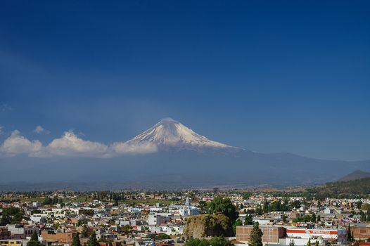 Popocatepetl Volcano Towering over the town of Puebla, Mexico