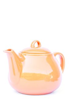 Orange ceramic teapot isolated on white background, stock photo