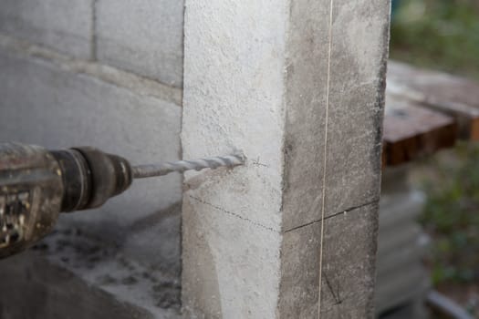 Electric Drill on concrete pillar