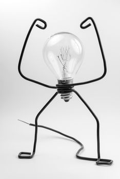 Emotional fantasy figure of a transparant light bulb and black electrical wires
