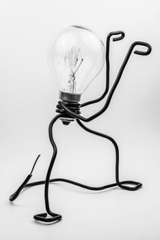 Emotional fantasy figure of a transparant light bulb and black electrical wires
