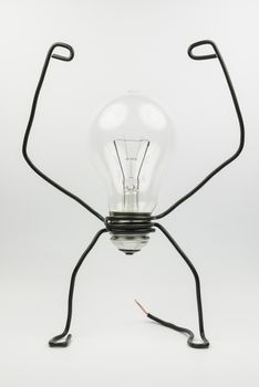 Emotional fantasy figure of a transparant light bulb and black electrical wires
