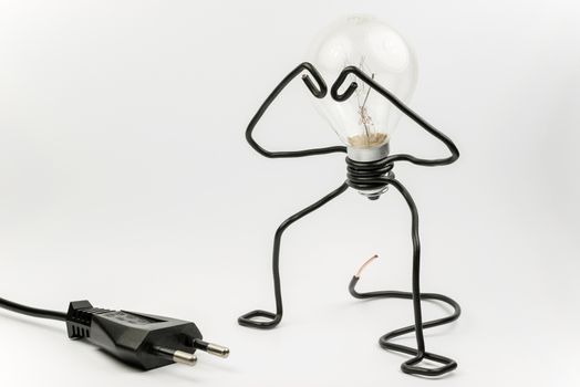 Emotional fantasy figure of a transparant light bulb and black electrical wires
