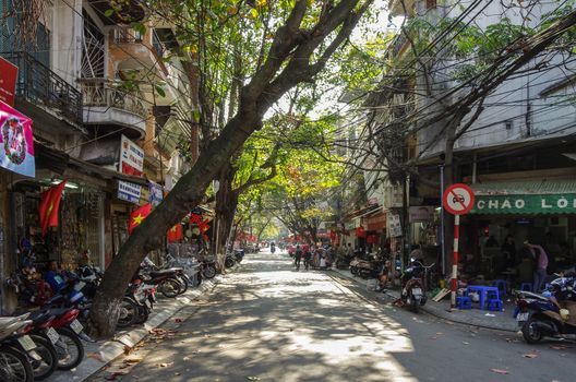 HANOI, Vietnam -  January 1 2015: Downtown street life. Vietnam capital in whinter