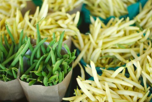 green beans and yellow beans in basket at the market