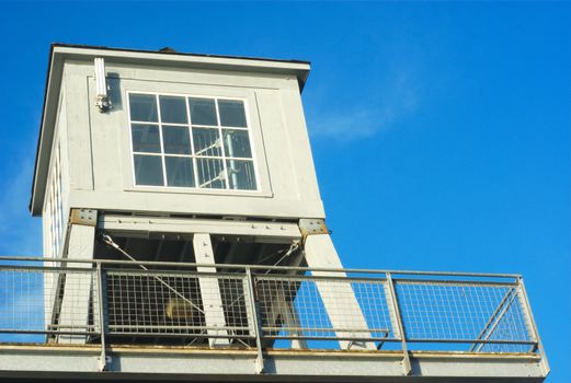 gray watch tower lighthouse marina blue sky