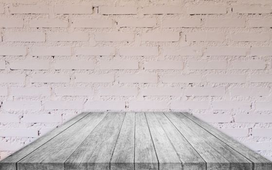 Perspective black and white wooden table top with brick wall decorated in coffee shop