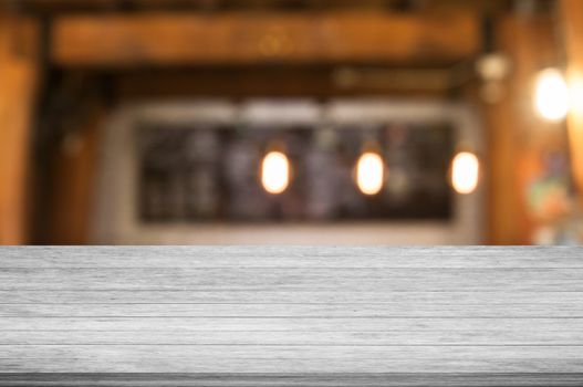 Top of black and white wooden table with coffee shop blurred abstract background