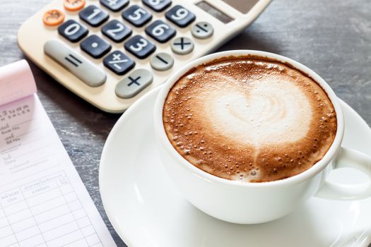 Coffee cup on work station, stock photo