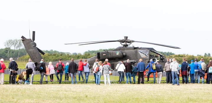 LEEUWARDEN, THE NETHERLANDS - JUN 11, 2016: Boeing AH-64 Apache attack helicopter flying a demo during the Royal Netherlands Air Force Days