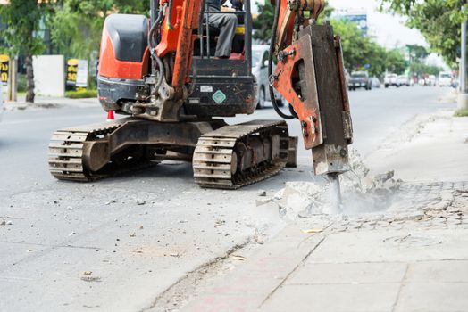 Car drills to repair roads