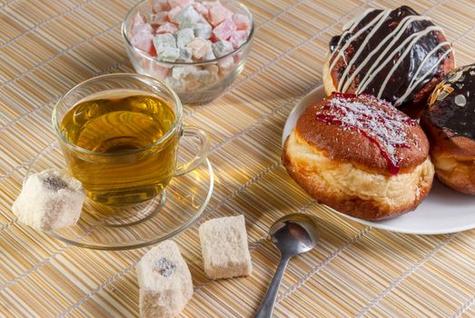 Green tea, fresh cherry muffin, colorful delight and doughnut, sweet dessert, close up