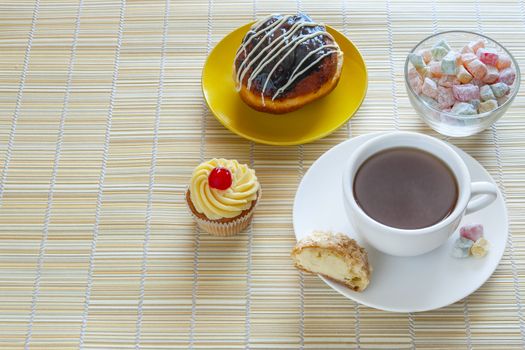 Tea, fresh cherry muffin, colorful delight, half eclair and doughnut, sweet dessert, with place for your text