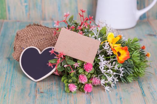 Bouquet of flowers with blank paper tag