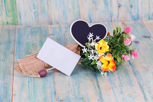 Bouquet of flowers with blank paper tag