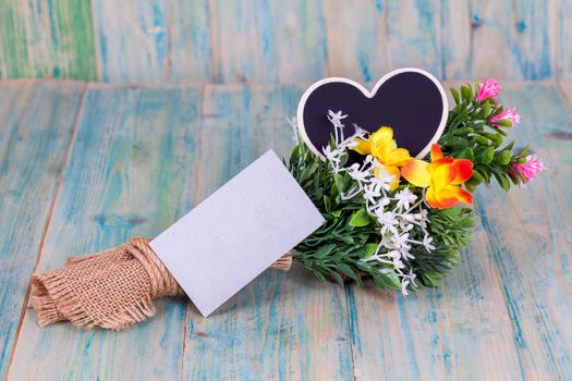 Bouquet of flowers with blank paper tag