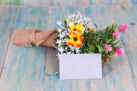 Bouquet of flowers with blank paper tag