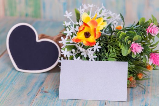 Bouquet of flowers with blank paper tag