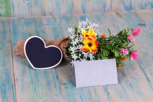 Bouquet of flowers with blank paper tag