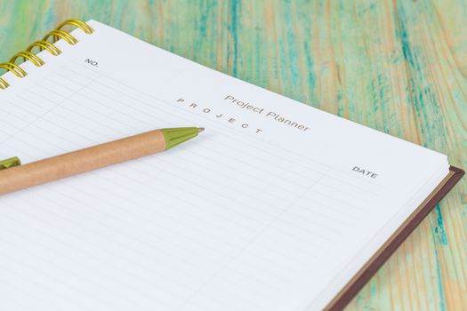 Closeup to agenda on project planner book