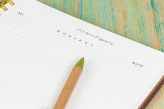 Closeup to agenda on project planner book