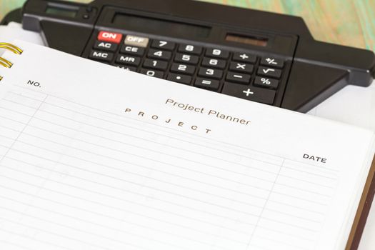 Closeup to agenda on project planner book