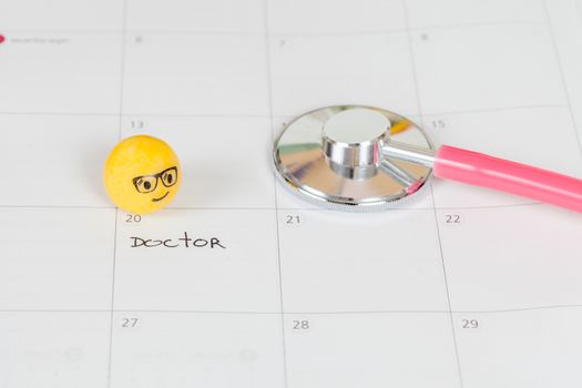 The words Doctor written on a Calendar to Remind you an Important Appointment
