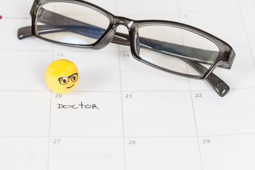 The words Doctor written on a Calendar to Remind you an Important Appointment
