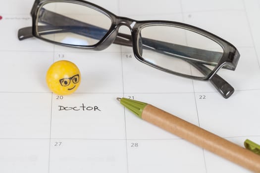 The words Doctor written on a Calendar to Remind you an Important Appointment
