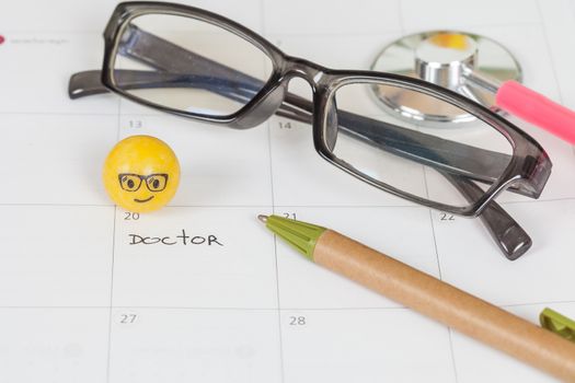 The words Doctor written on a Calendar to Remind you an Important Appointment
