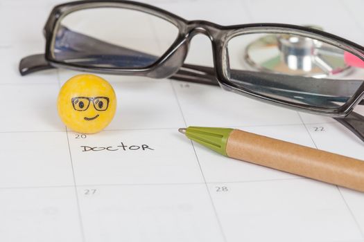 The words Doctor written on a Calendar to Remind you an Important Appointment
