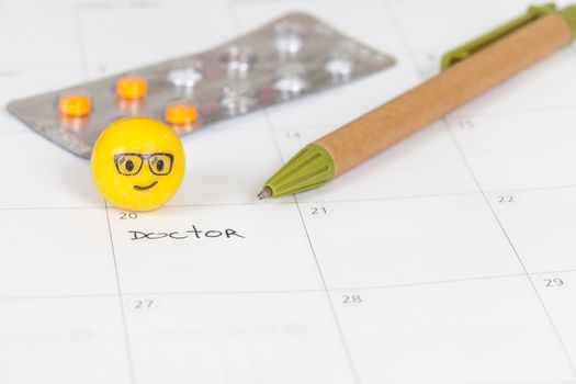 The words Doctor written on a Calendar to Remind you an Important Appointment
