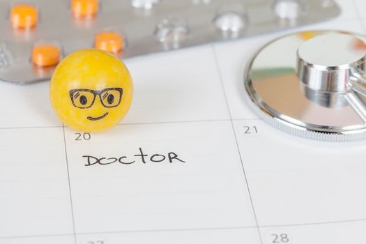 The words Doctor written on a Calendar to Remind you an Important Appointment
