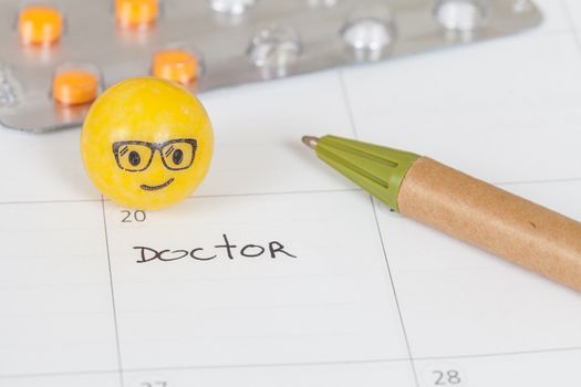 The words Doctor written on a Calendar to Remind you an Important Appointment