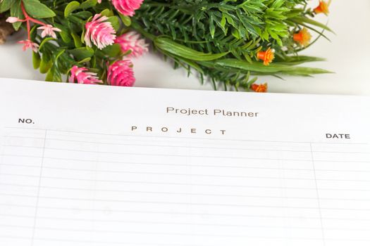 Closeup to agenda on project planner book