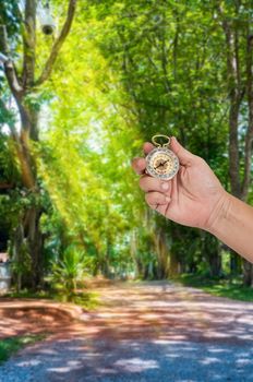 man holding compass in hand