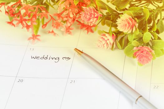 Reminder Wedding day in calendar with pen