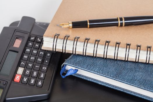 Diary with  pen  on white background