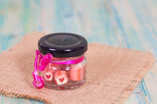 candies sweets heart in bottle on table