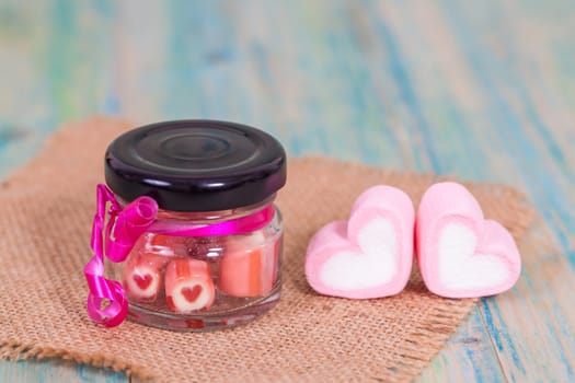 candies sweets heart in bottle on table