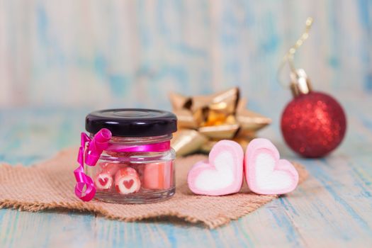 candies sweets heart in bottle on table
