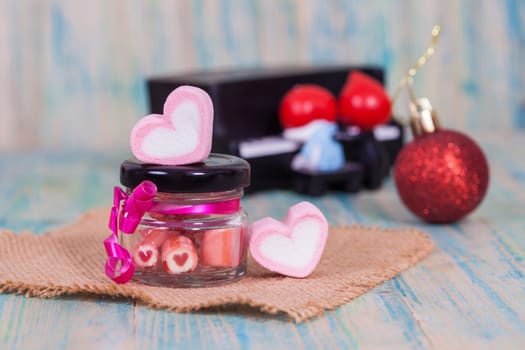 candies sweets heart in bottle on table