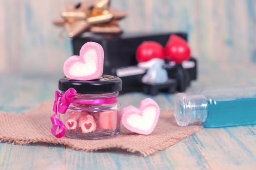 candies sweets heart in bottle on table