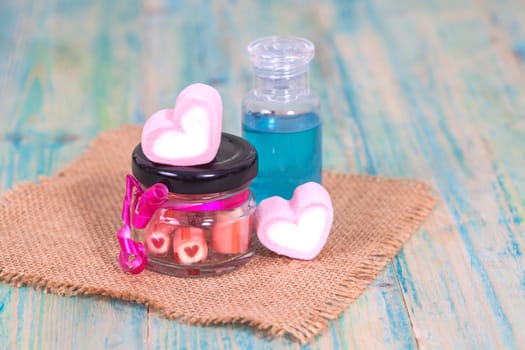 candies sweets heart in bottle on table